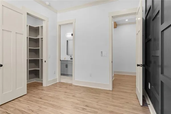 a view of a hardwood & utility room
