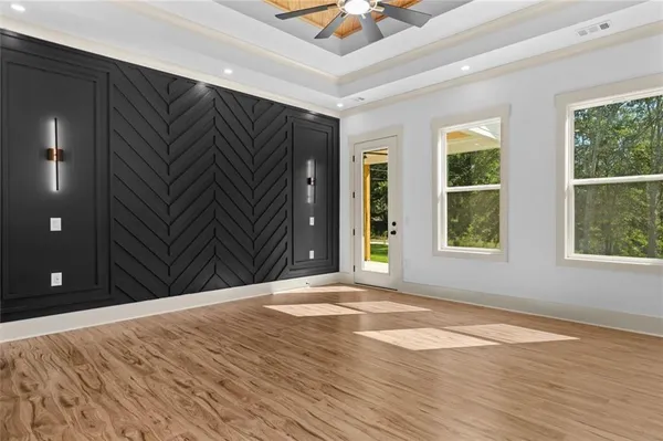 wooden floor in an empty room with a window