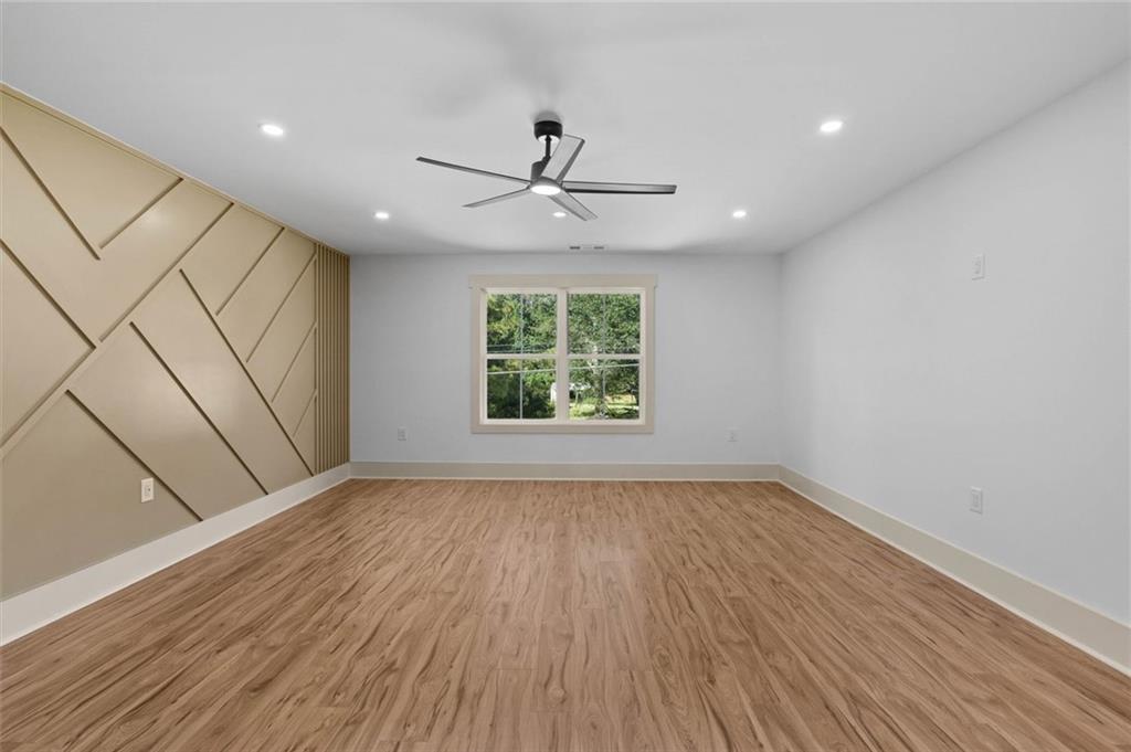 1960 Lost Mountain Road Powder Springs, GA 30127 - Photo 56 of 56 wooden floor in an empty room with a window