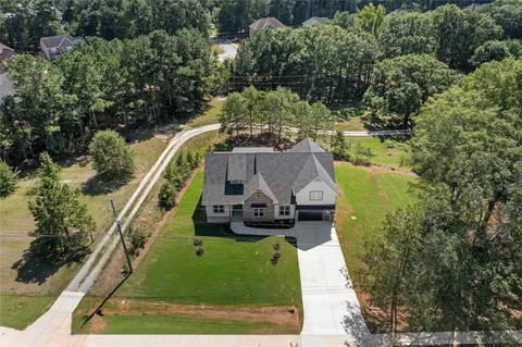 an aerial view of a house with a garden