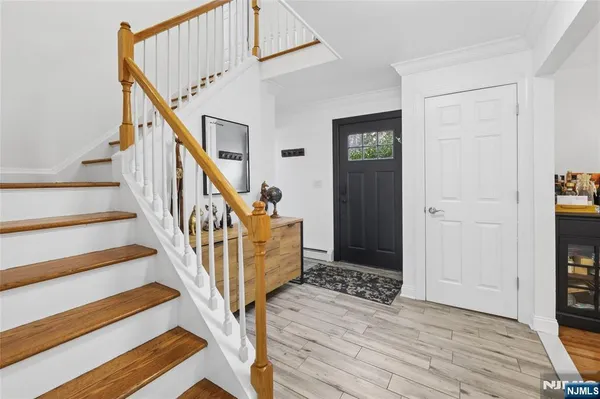 a bathroom with a sink shower and a mirror