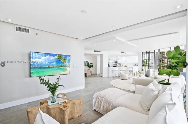 a living room with furniture dining area and a potted plant