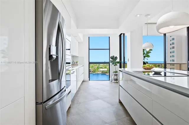 a kitchen with stainless steel appliances a refrigerator and a sink