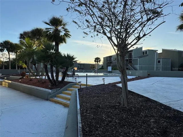 a view of a yard with swimming pool