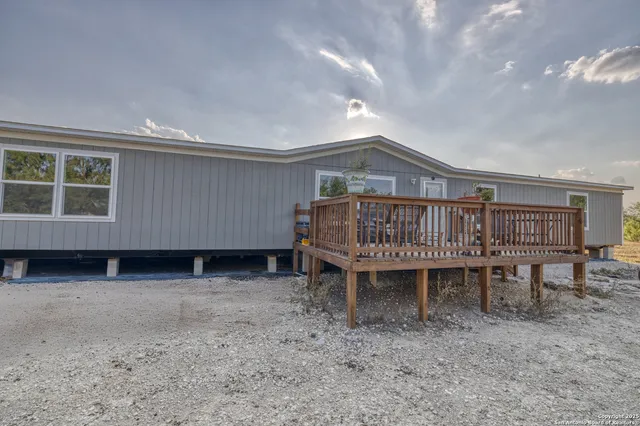 a view of a chairs on wooden deck