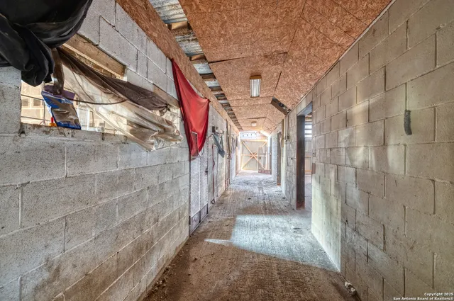 a view of a garage with wooden floor