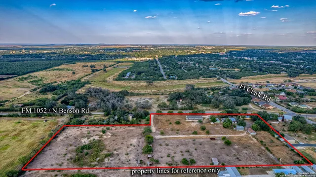 an aerial view of a house with mountain view