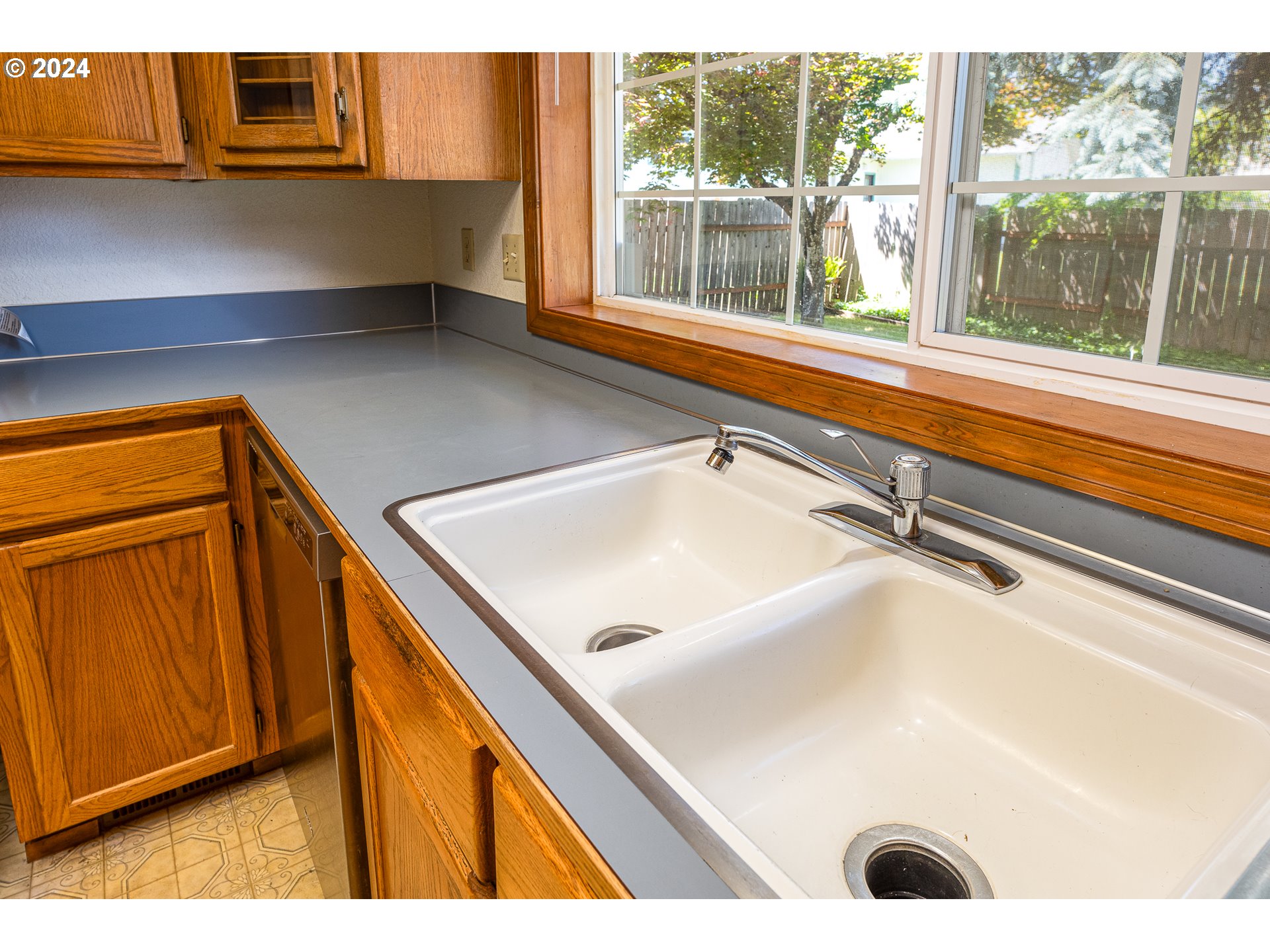 378 70th Street Springfield, OR 97478 - Photo 13 of 39 a view of a sink a window and an empty room