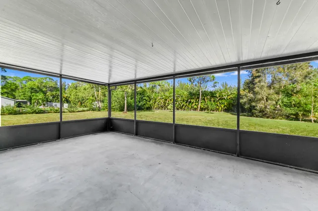 a view of an empty room with a large window