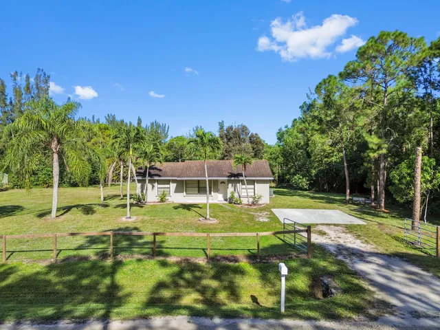a swimming pool with some trees in the background