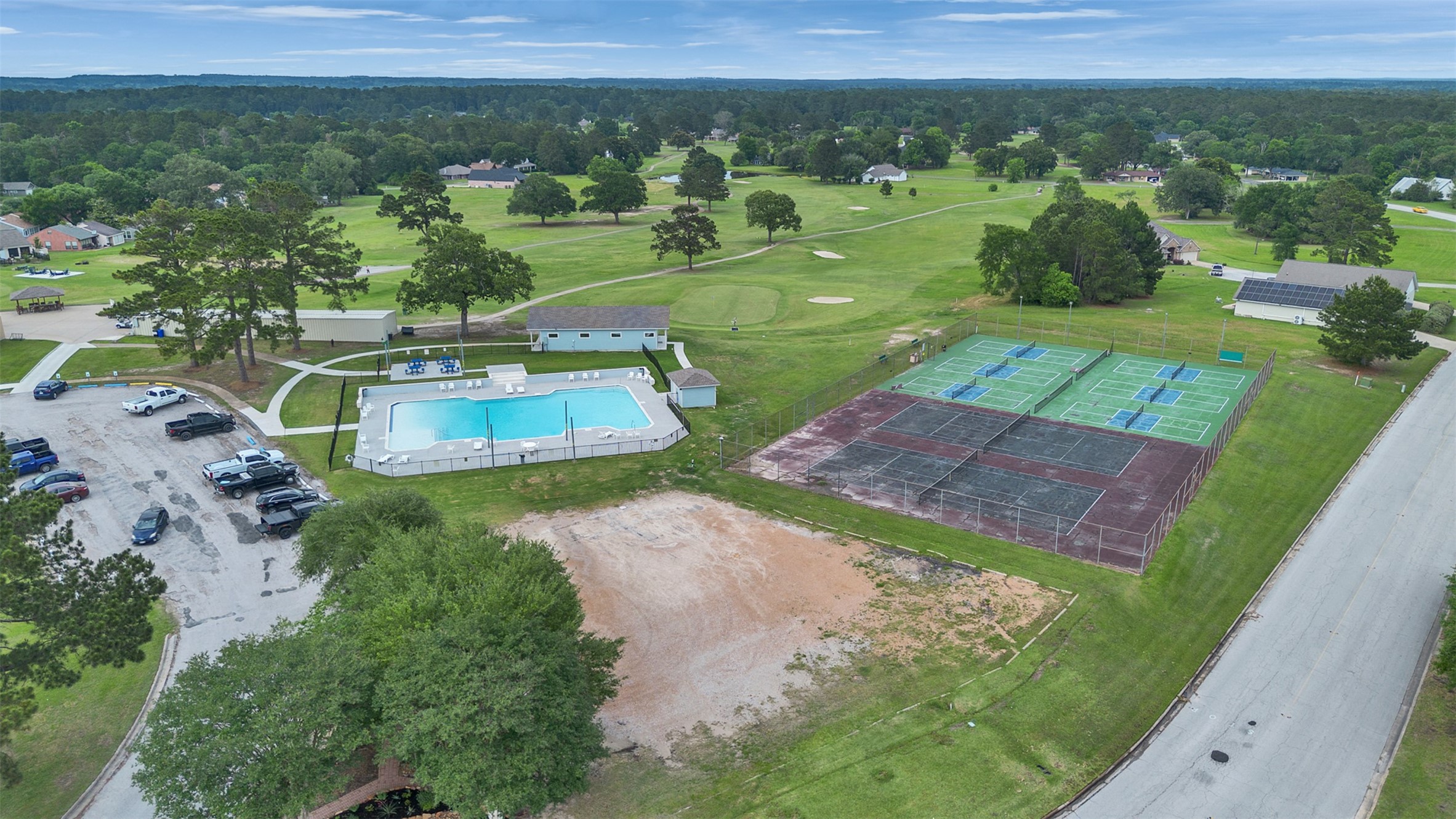 195 Coral Gables Trinity, TX 75862 - Photo 46 of 50 an aerial view of a house with a yard