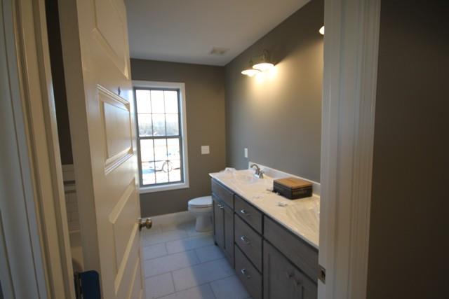 5548 Flewellyn Road Springfield, TN 37172 - Photo 13 of 16 a bathroom with a granite countertop sink and a window