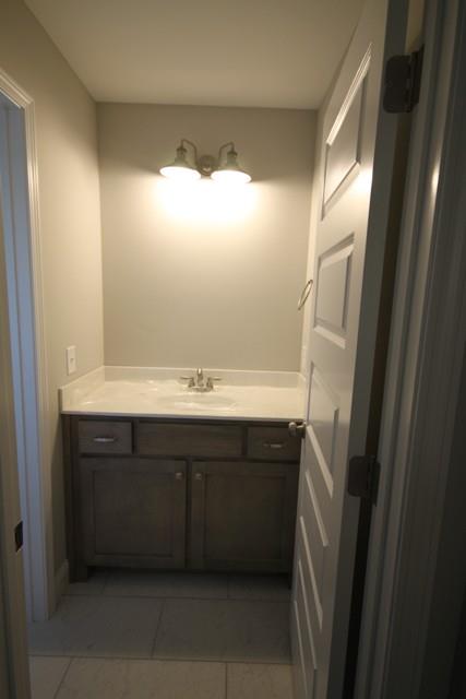 5548 Flewellyn Road Springfield, TN 37172 - Photo 14 of 16 a bathroom with a sink and mirror