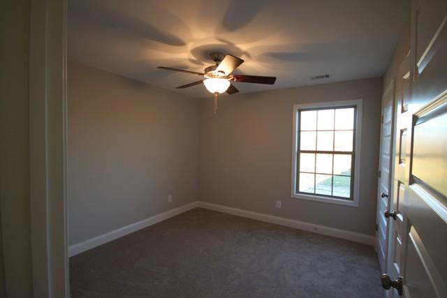 5548 Flewellyn Road Springfield, TN 37172 - Photo 15 of 16 an empty room with windows and fan