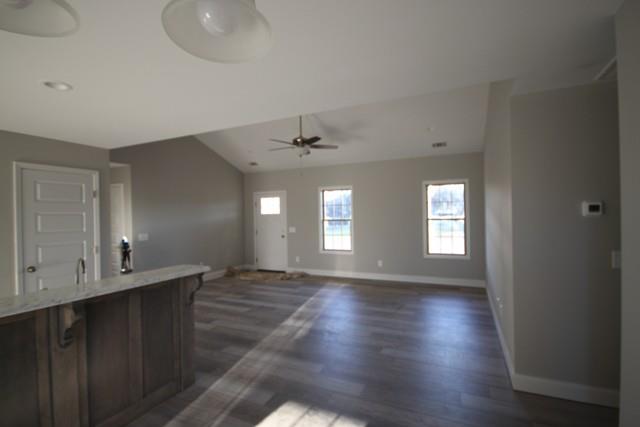 5548 Flewellyn Road Springfield, TN 37172 - Photo 6 of 16 a view of an empty room with window and wooden floor