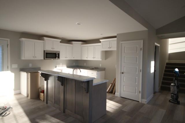 5548 Flewellyn Road Springfield, TN 37172 - Photo 7 of 16 a kitchen with stainless steel appliances granite countertop a refrigerator and a stove top oven