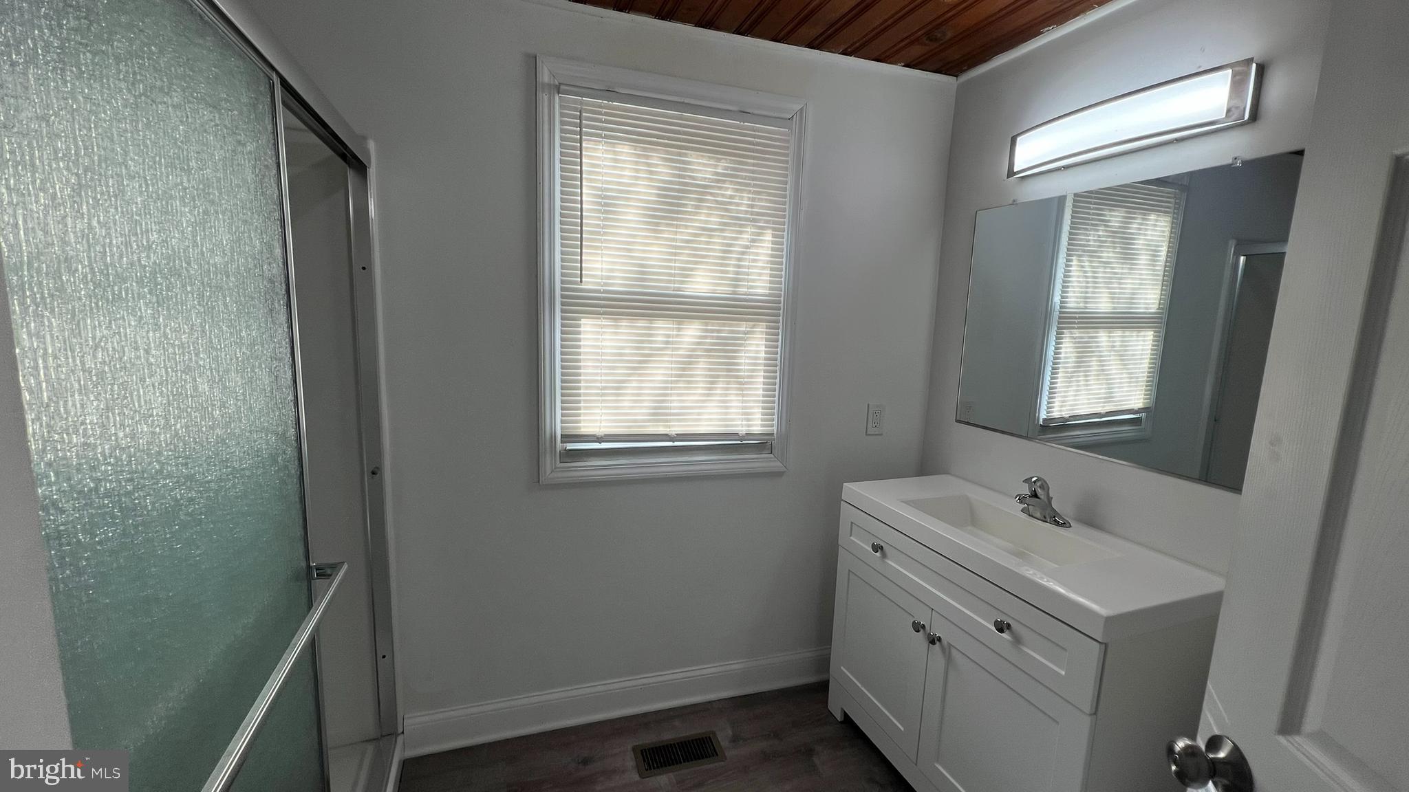 65 Egg Harbor Road, Unit A Berlin, NJ 08009 - Photo 14 of 15 a bathroom with a sink toilet and mirror