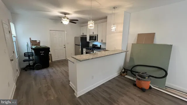 a room with furniture and wooden floor