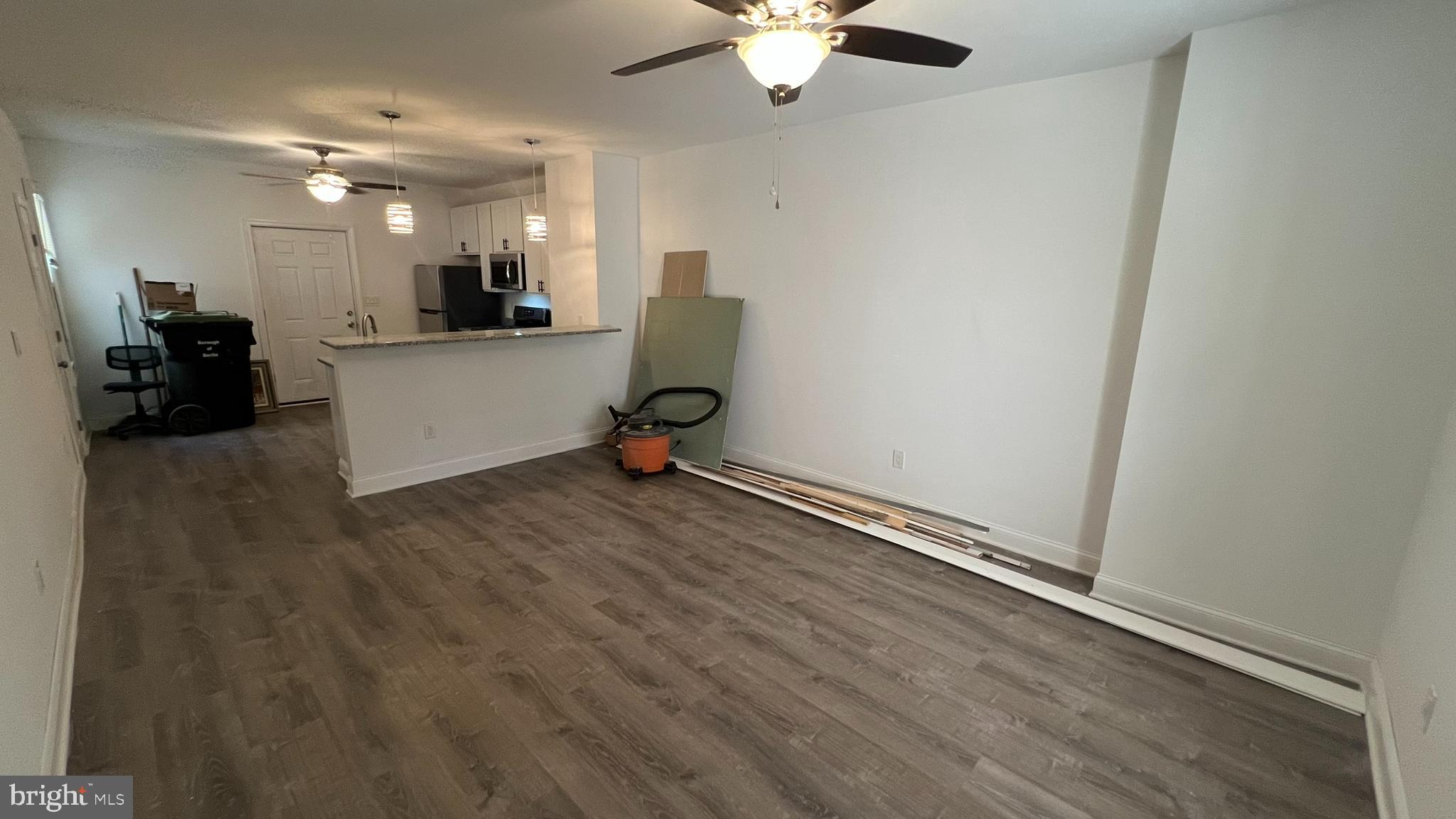 65 Egg Harbor Road, Unit A Berlin, NJ 08009 - Photo 8 of 15 a view of a room with wooden floor and a window