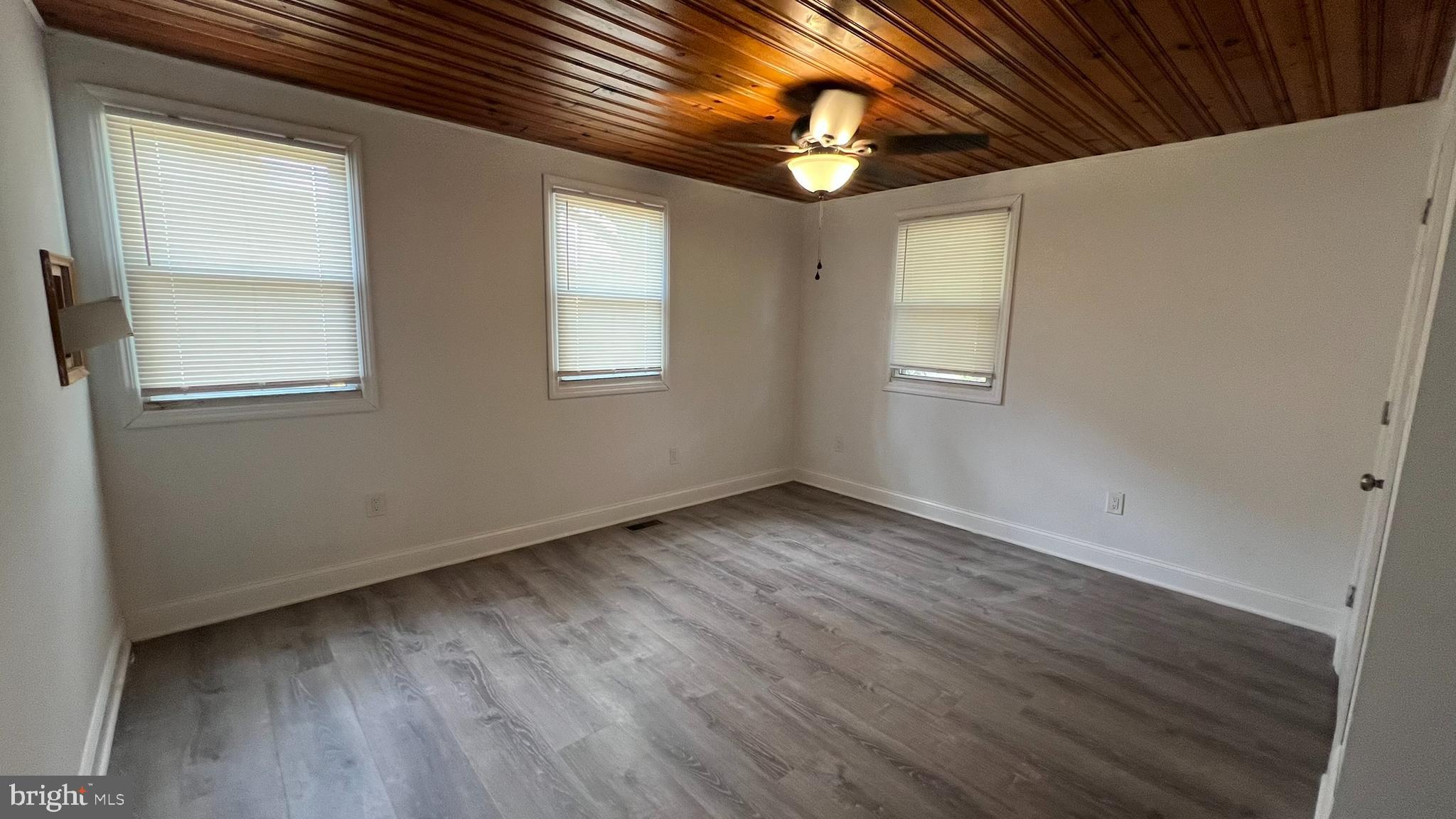 65 Egg Harbor Road, Unit A Berlin, NJ 08009 - Photo 10 of 15 a view of an empty room with wooden floor and a window