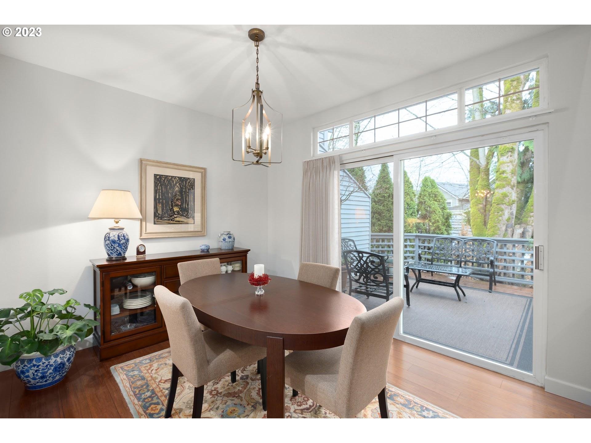 9729 Northwest Silver Ridge Loop Portland, OR 97229 - Photo 13 of 32 a view of a dining room with furniture window and outside view