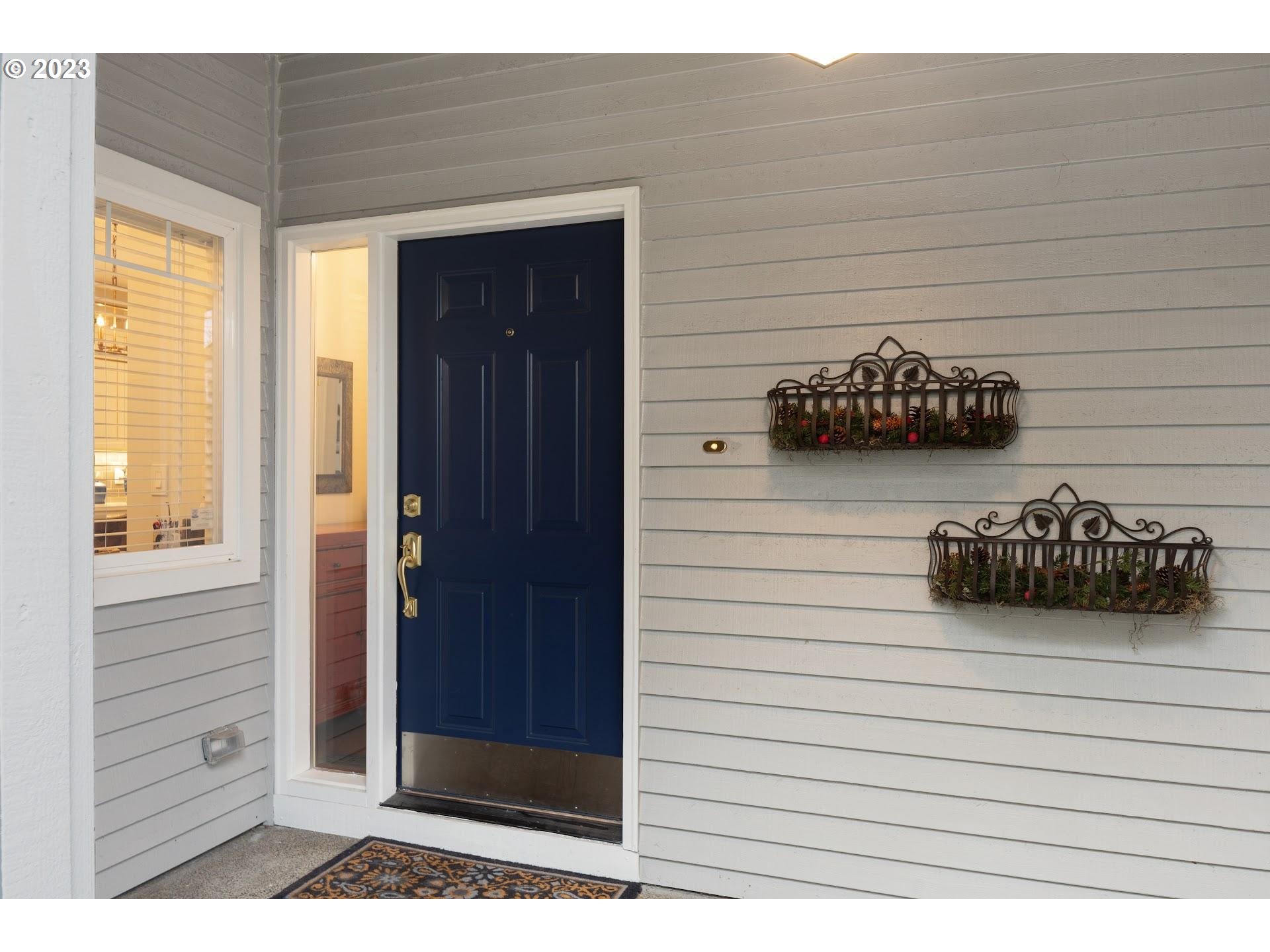 9729 Northwest Silver Ridge Loop Portland, OR 97229 - Photo 2 of 32 a view of front door and bedroom