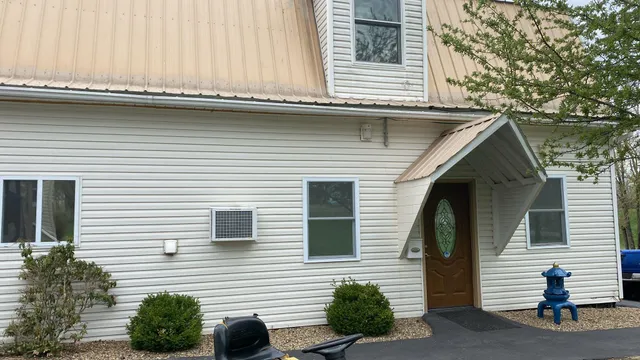 a view of house with outdoor space