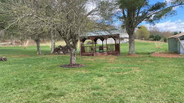 a backyard of a house with lots of green space