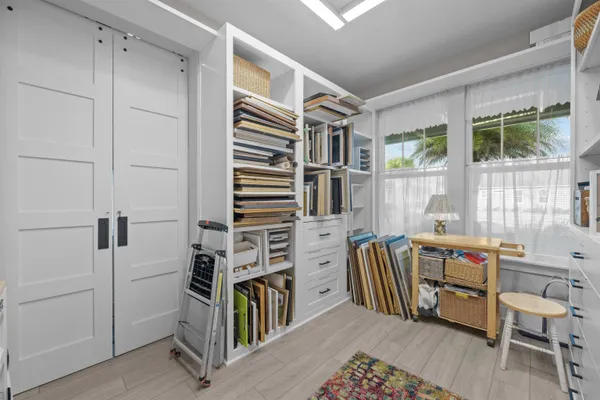 a bedroom with furniture and a window