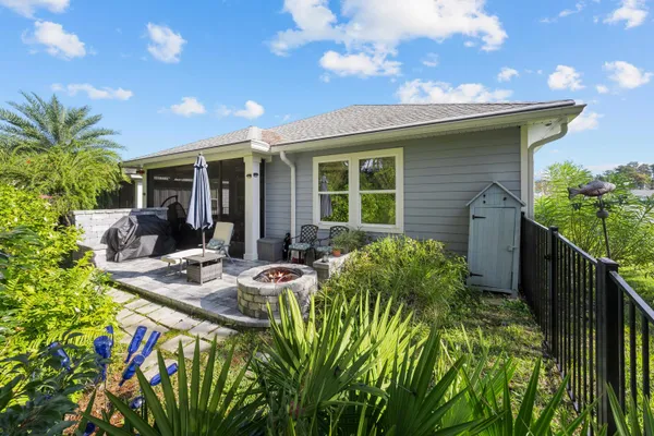 a front view of house with yard and outdoor seating