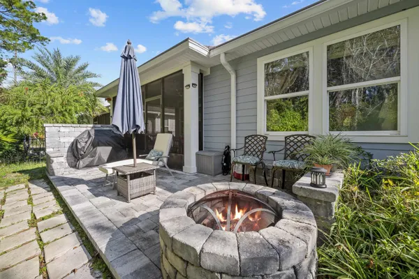 a outdoor space with patio couches and a potted plant