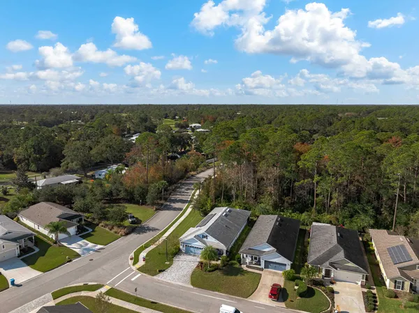 a view of a patio with table and chairs