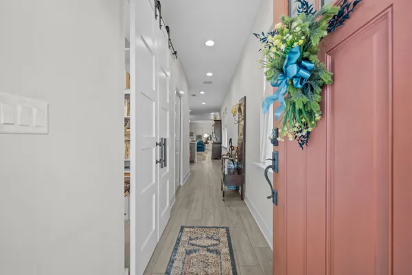 a view of a hallway with a potted plant