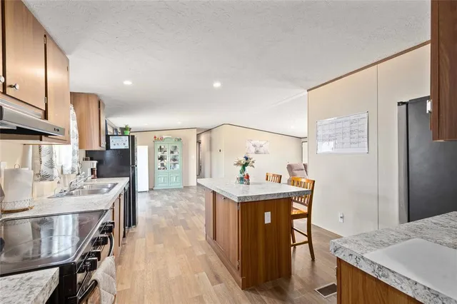 a large living room with furniture and a large window