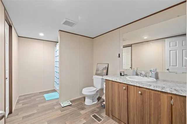 a bedroom with a bed and cabinets