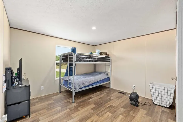 a bedroom with bed and a window