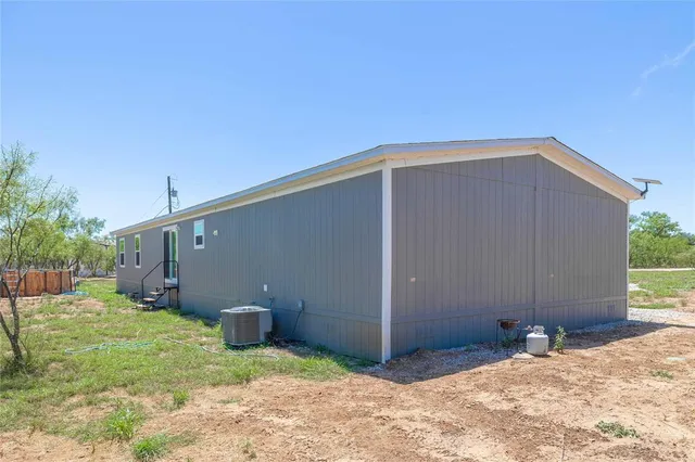 a house with trees in the background