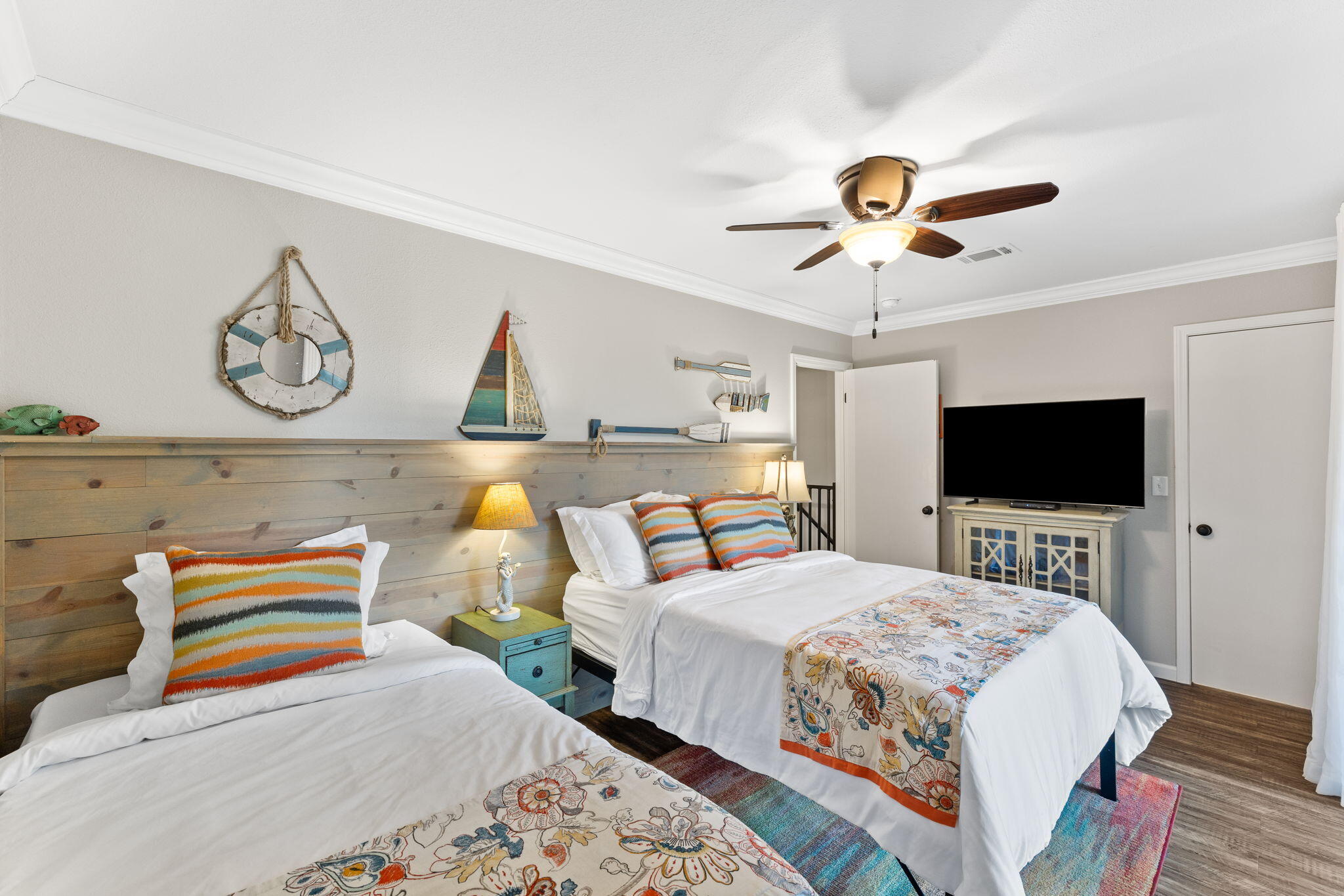 125 Cassine Garden Circle, Unit 129 Santa Rosa Beach, FL 32459 - Photo 13 of 70 a bedroom with a bed and a flat screen tv