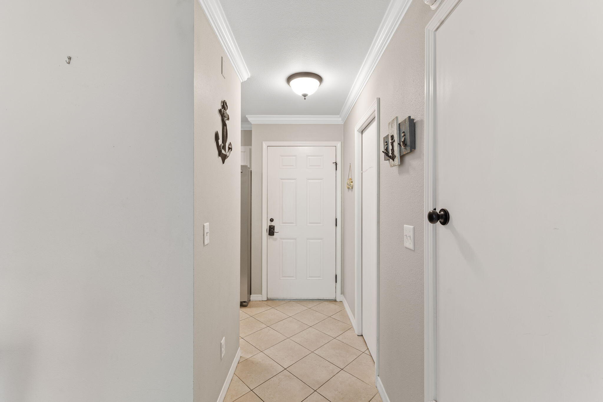 125 Cassine Garden Circle, Unit 129 Santa Rosa Beach, FL 32459 - Photo 14 of 70 a view of a hallway with wooden floor