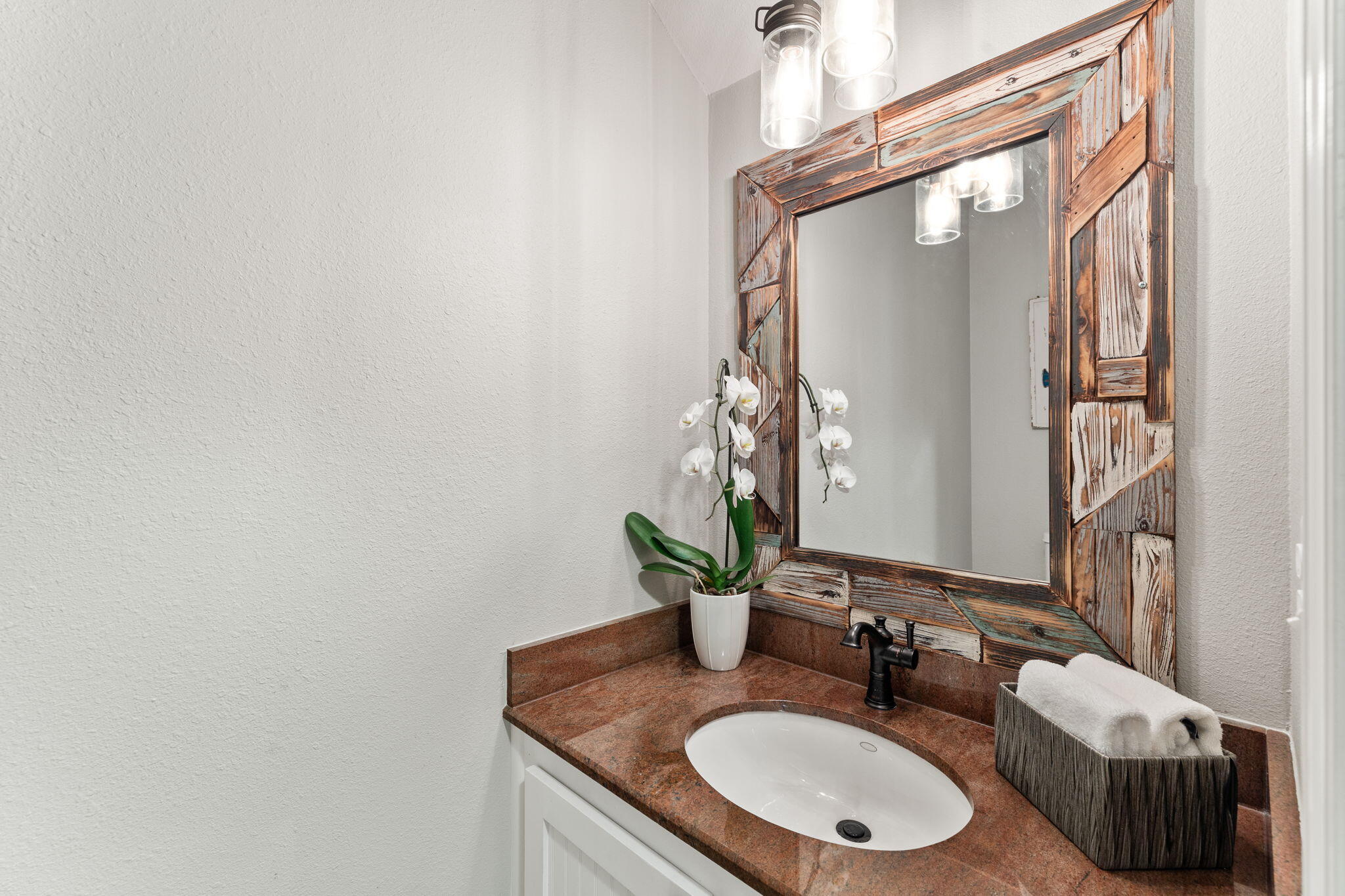 125 Cassine Garden Circle, Unit 129 Santa Rosa Beach, FL 32459 - Photo 15 of 70 a bathroom with a granite countertop sink and a mirror