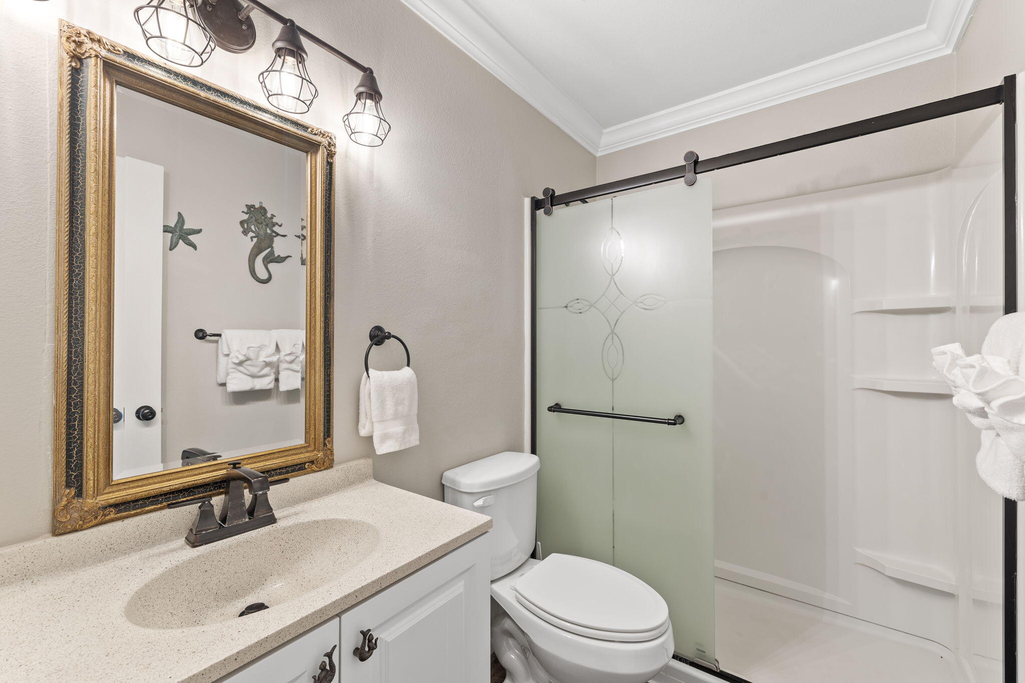 125 Cassine Garden Circle, Unit 129 Santa Rosa Beach, FL 32459 - Photo 22 of 70 a bathroom with a sink vanity mirror and shower