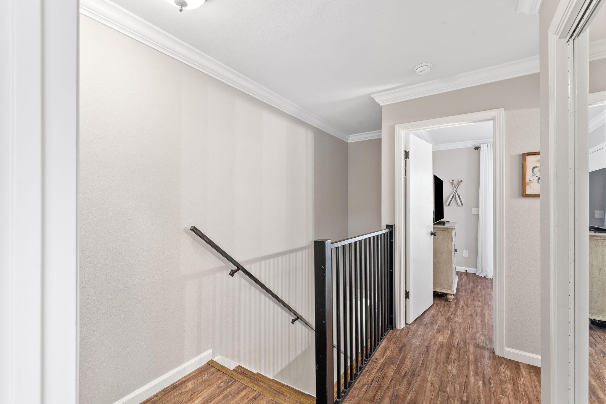 125 Cassine Garden Circle, Unit 129 Santa Rosa Beach, FL 32459 - Photo 24 of 70 a view of a hallway with wooden floor