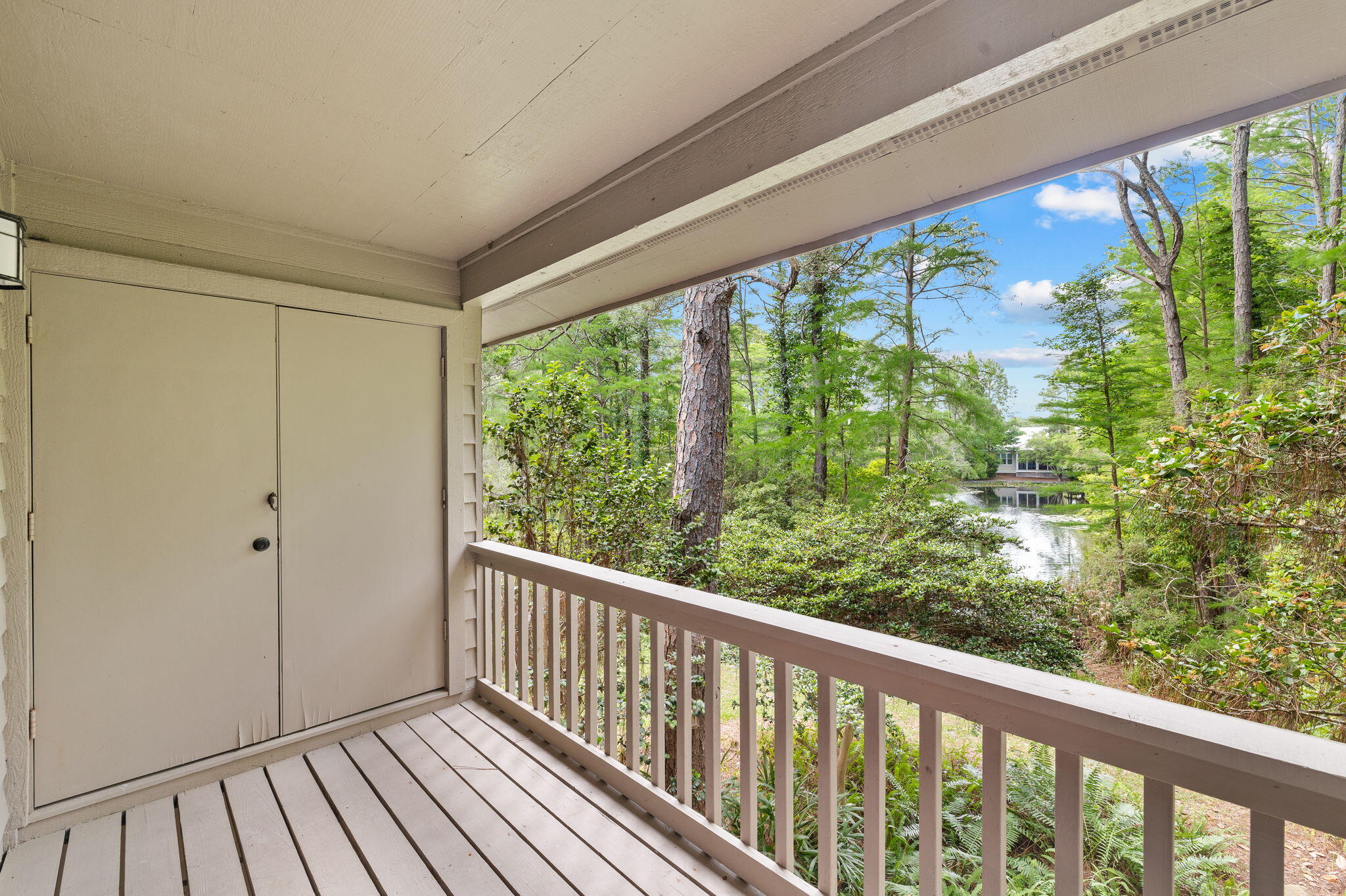 125 Cassine Garden Circle, Unit 129 Santa Rosa Beach, FL 32459 - Photo 30 of 70 a view of a balcony with wooden floor