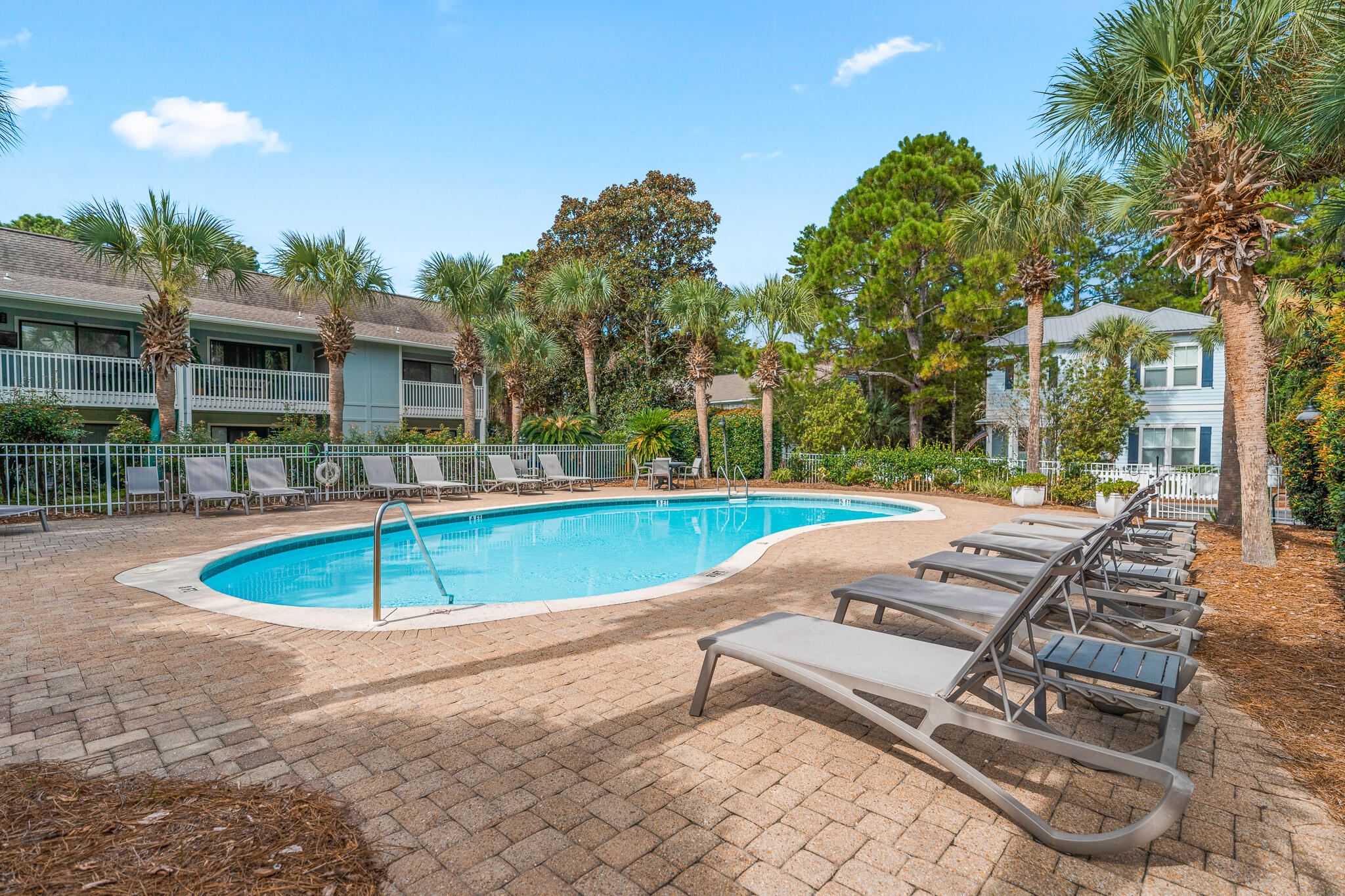 125 Cassine Garden Circle, Unit 129 Santa Rosa Beach, FL 32459 - Photo 44 of 70 a view of a swimming pool with a lounge chairs