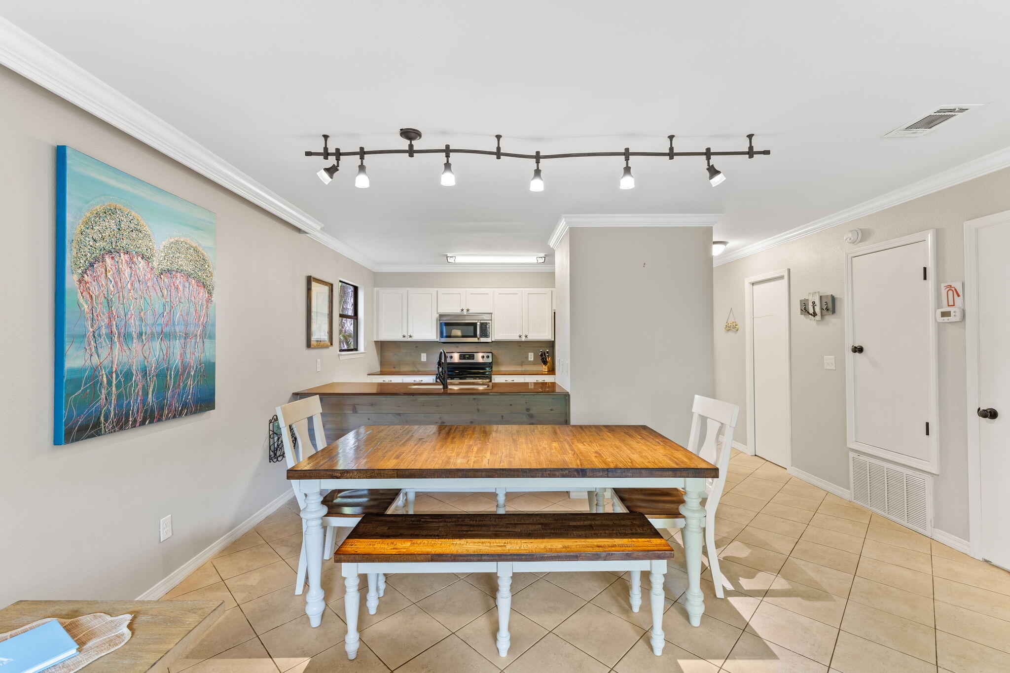 125 Cassine Garden Circle, Unit 129 Santa Rosa Beach, FL 32459 - Photo 10 of 70 a room with table chairs and window