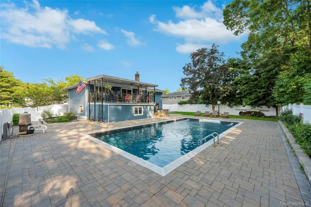a view of a swimming pool with a patio