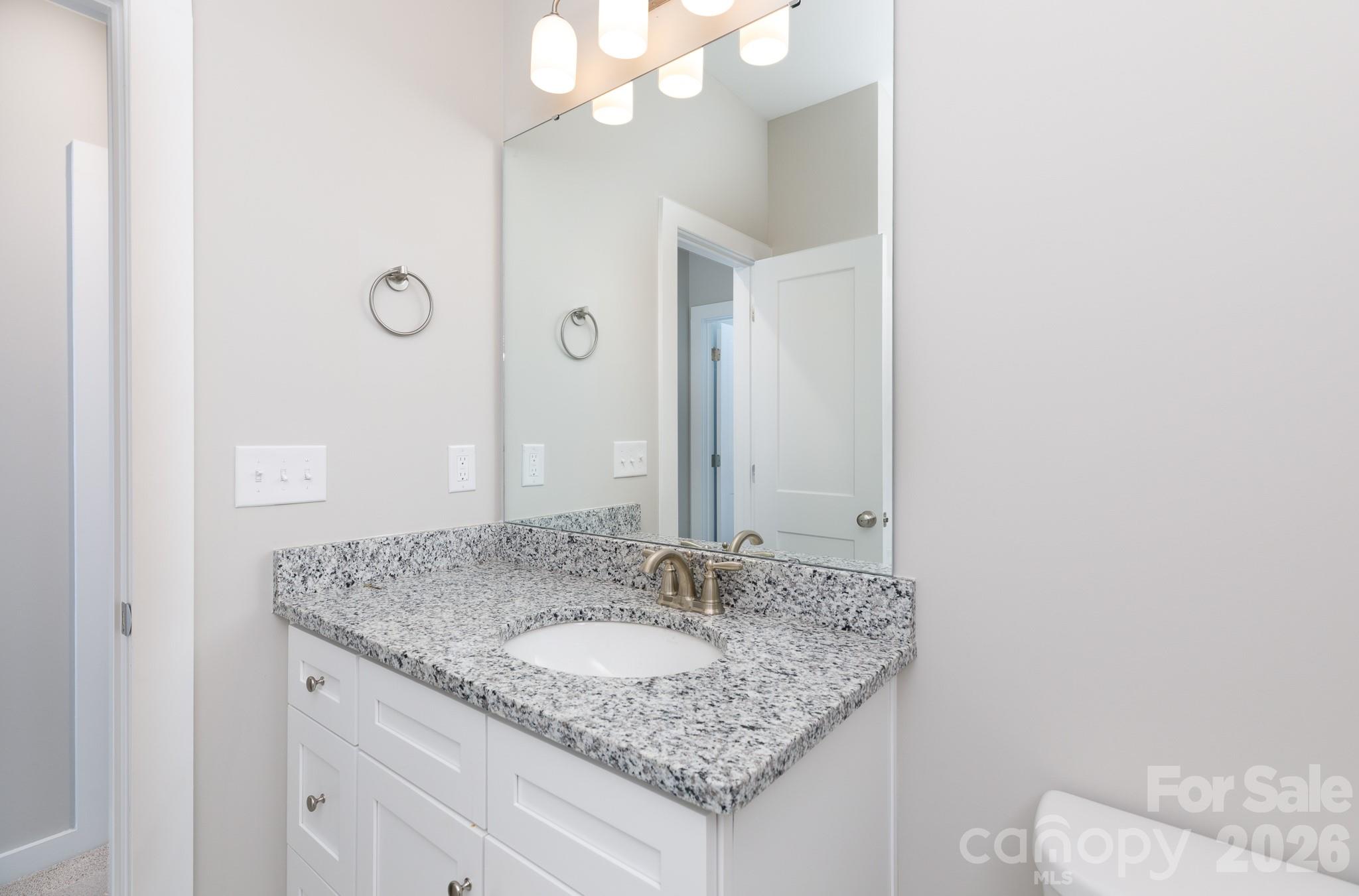 3339 Lesslie Highway, Unit 2 Rock Hill, SC 29730 - Photo 18 of 46 a bathroom with a granite countertop sink and a mirror