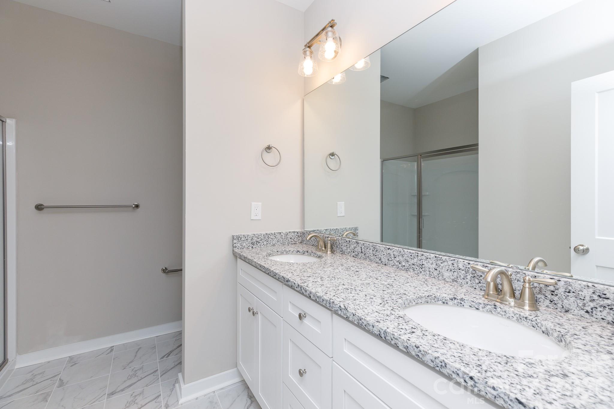3339 Lesslie Highway, Unit 2 Rock Hill, SC 29730 - Photo 28 of 46 a bathroom with a granite countertop sink and a mirror
