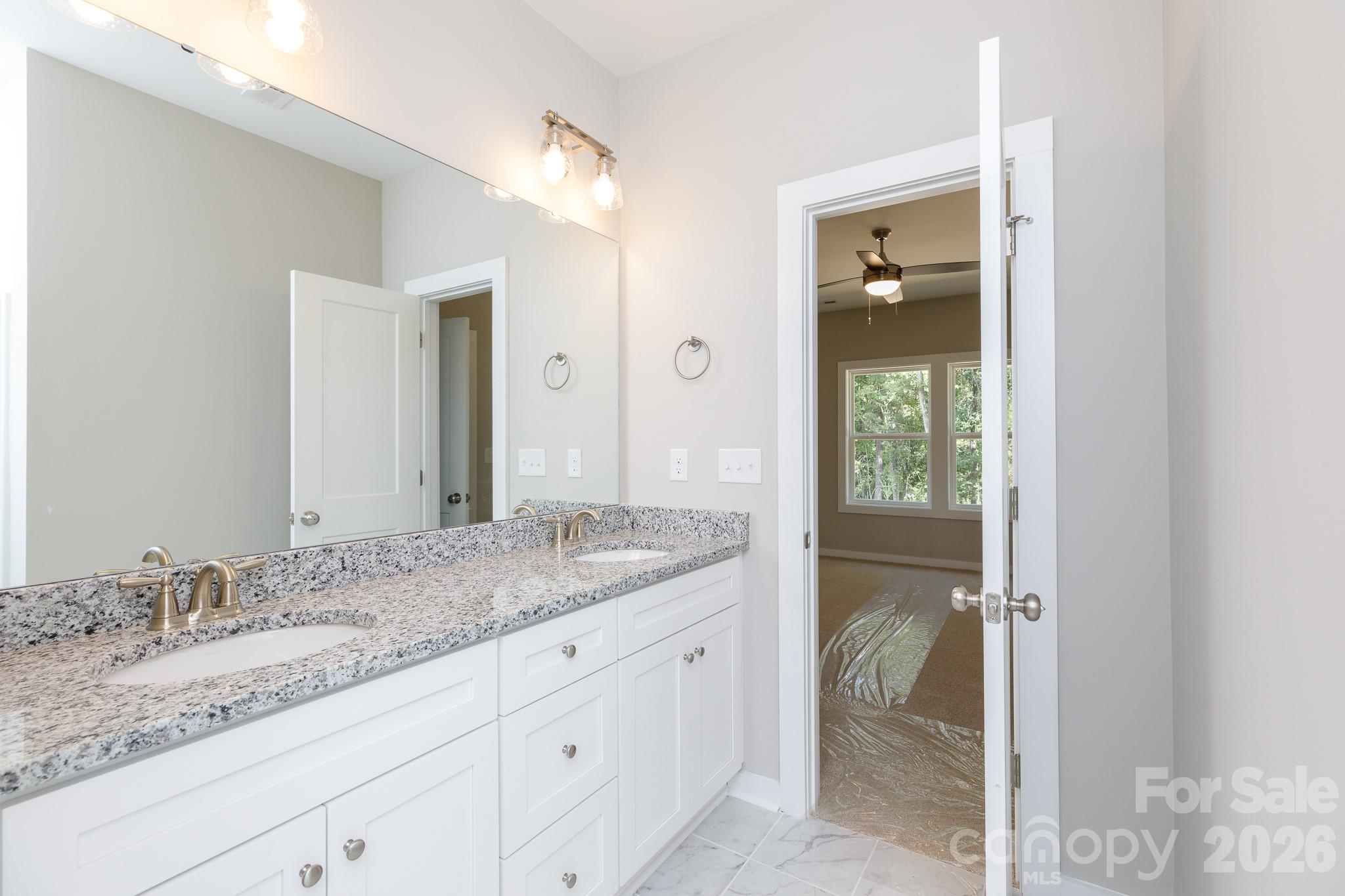 3339 Lesslie Highway, Unit 2 Rock Hill, SC 29730 - Photo 29 of 46 a bathroom with a granite countertop sink and a mirror