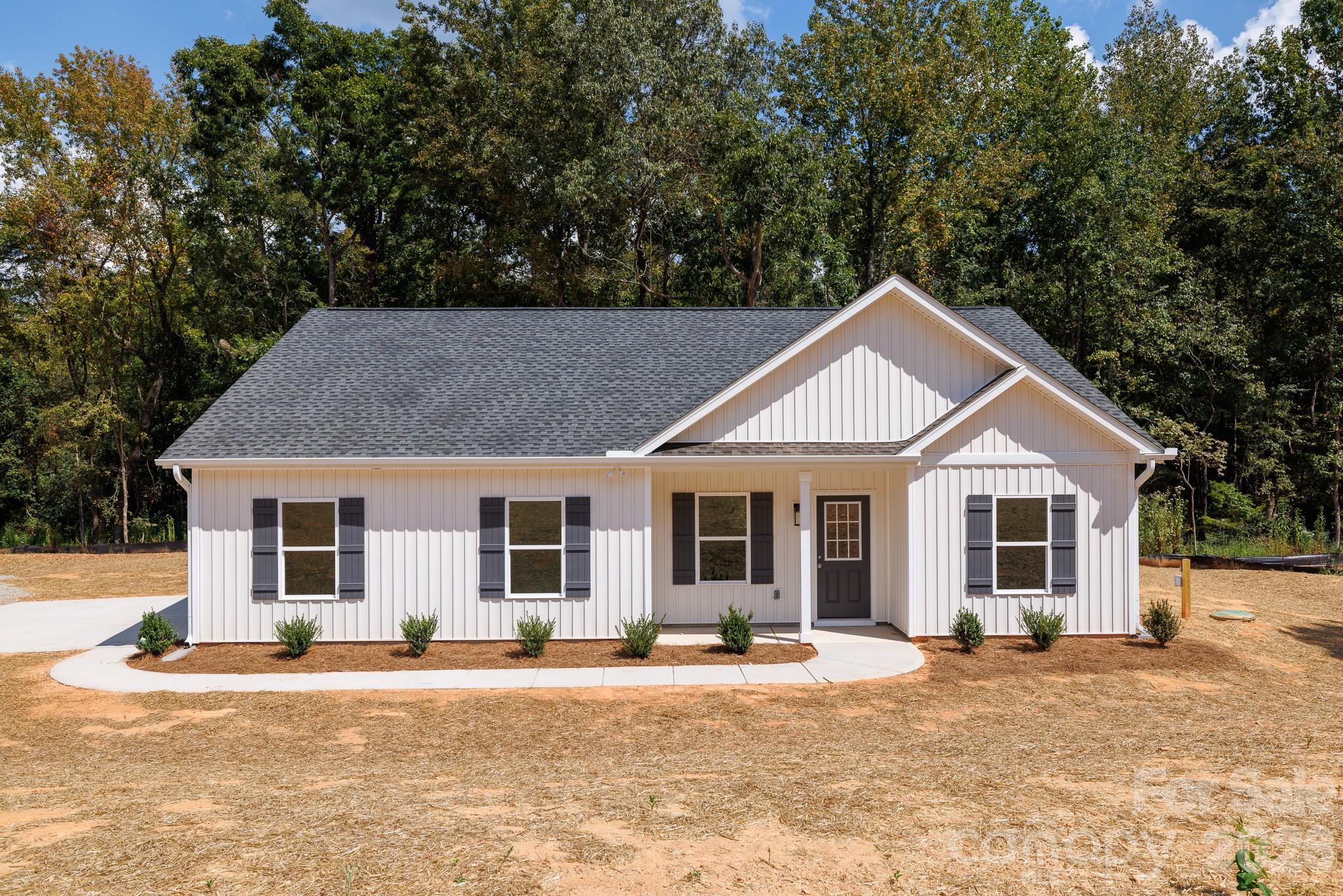 3339 Lesslie Highway, Unit 2 Rock Hill, SC 29730 - Photo 34 of 46 a front view of a house with a yard and garage